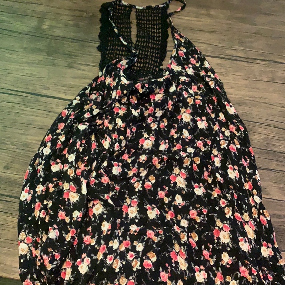 A black floral tank top it has a biting design in the back very nice for summer